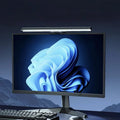 Aurora monitor light bar casting glare-free light across a desk